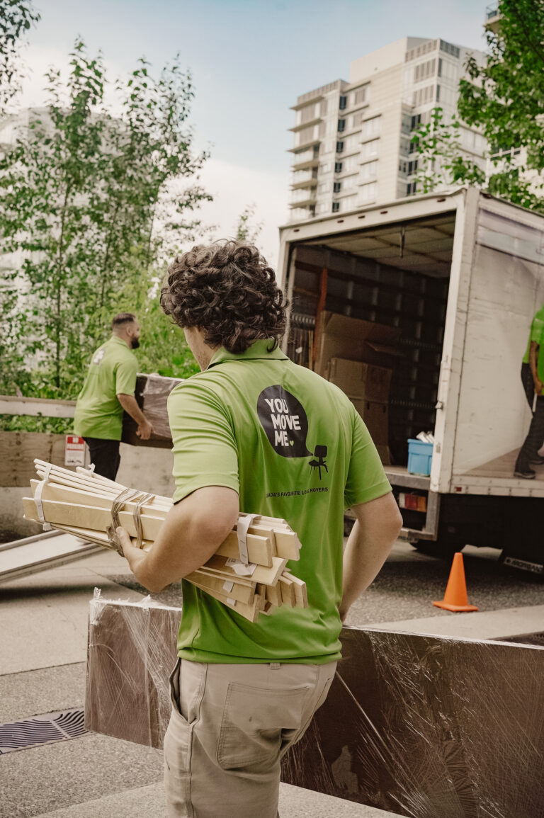 You Move Me movers moving furniture onto truck