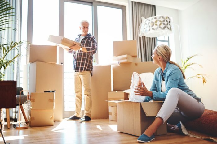 senior couple packing up their home